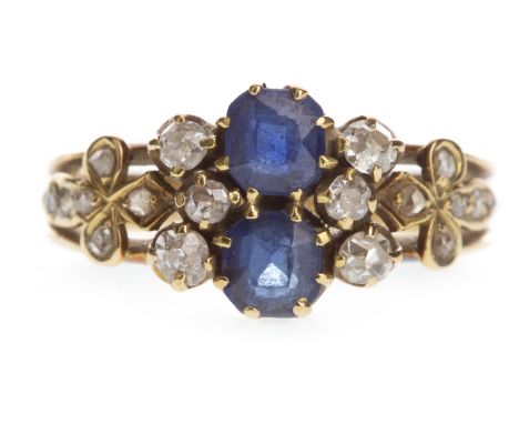BLUE GEM AND DIAMOND RING, set with two cushion shaped blue gems surrounded by old cut diamonds totalling approximately 0.30 