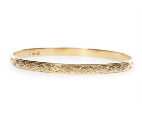 GOLD BANGLE, of circular form, with engraved decoration, 65mm inner diameter, marked 585, 20.5g Please read the content of th
