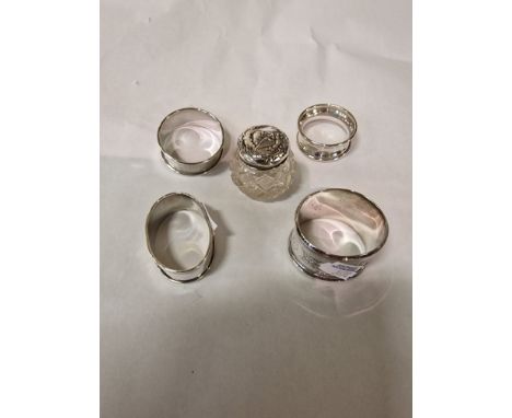 FOUR H/M SILVER NAPKIN RINGS &amp; A SILVER TOPPED BOTTLE - 2.2 OZS APPROX