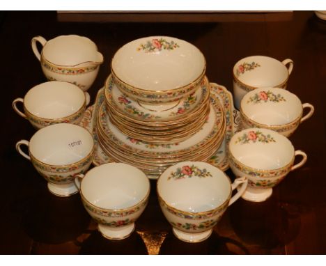 A Foley 'Ming Rose' part coffee service, gilt edged and decorated with flowers in red and yellow, to include six cups, saucer