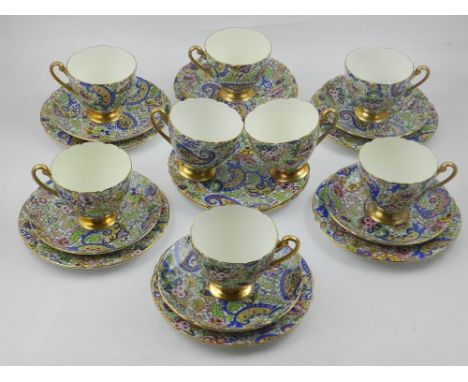 Shelley, England. A set of eight cups, four saucers, and eight sandwich plates, in the paisley design, together with part tea