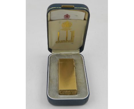 A Dunhill gold plated lighter in original fitted case with paperwork