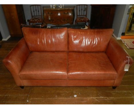 A late 20th century tan leather upholstered two seat sofa, W. 184cm.