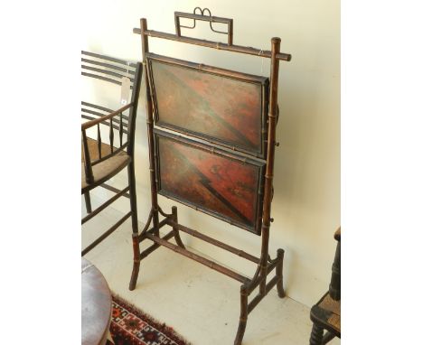 A Victorian folding two tier bamboo and lacquer standing shelf, W. 62cm.