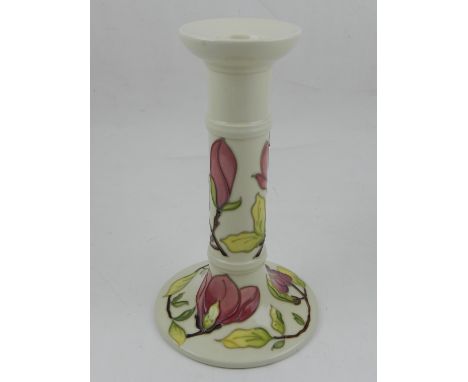 Moorcroft, England. A porcelain candlestick, with the magnolia pattern, signed W.M. no 75/94. H: 21cm D: 13cm