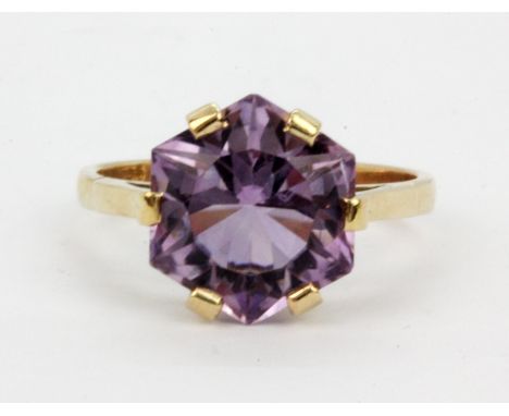 A 9ct yellow gold ring set with an unusually cut hexagonal amethyst, (R).