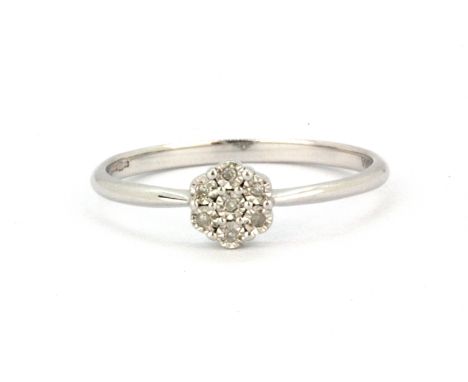 A 9ct white gold diamond set cluster ring, (M).