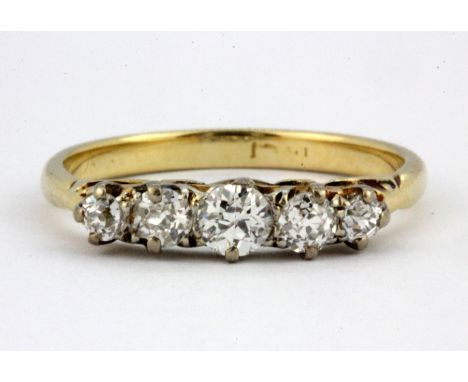 An 18ct yellow gold ring set with five graduated brilliant cut diamonds, approx. 0.65ct overall, (P.5).