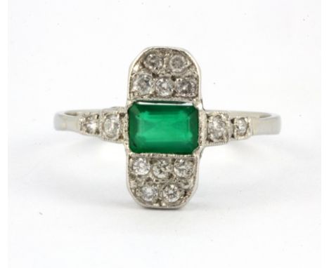 An Art Deco platinum ring set with a baguette cut emerald and diamonds, (R).