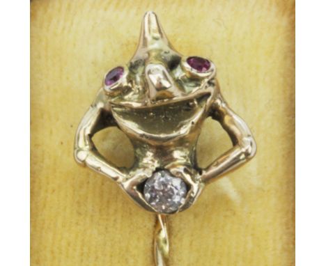 A boxed yellow metal (tested 14ct gold) stick pin set with ruby eyes and an old cut diamond, L. 6.5cm.
