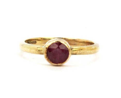 A 9ct yellow gold ruby set ring, (L).