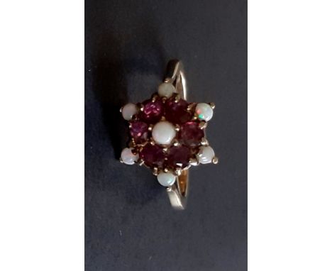 A 9ct yellow gold tourmaline and opal set cluster ring, (N.5).