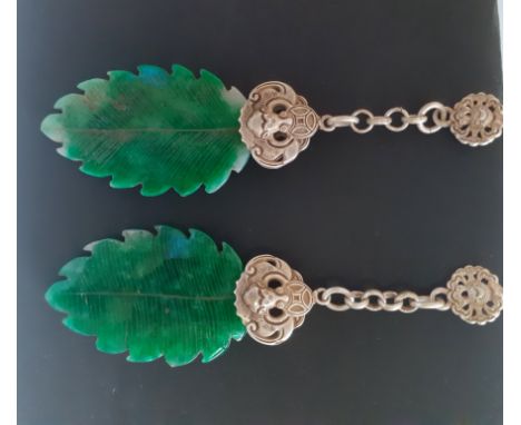 A pair of Chinese white metal carved jade / hardstone drop earrings, L. 9cm.