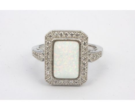 A 925 silver ring set with synthetic opal and white stones,  (R.5).