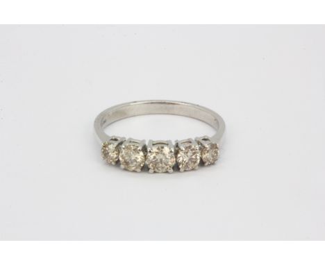 An 18ct white gold ring set with five graduated brilliant cut diamonds, approx. 1ct overall, (R).