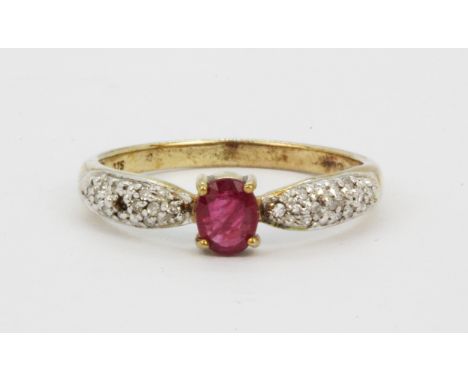 A 9ct yellow gold ring set with an oval cut ruby and diamond set shoulders, (one stone missing), (N).