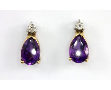 A pair of 9ct yellow gold stud earrings set with a pear cut amethyst and brilliant cut diamonds, L. 1.5cm.