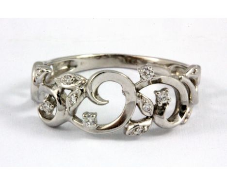 An 18ct white gold diamond set ring, (M.5).