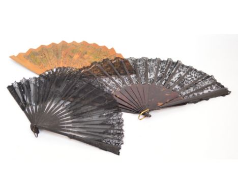 A faux tortoiseshell and lace folding fan with shaped guards and sticks and metal loop, the machine lace leaf of black lace b