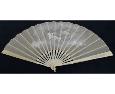 An early 20th century folding fan with carved and pierced guards with matching shaped pierced sticks, bone edged rivet and cr