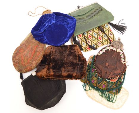 A quantity of vintage handbags including a beaded example, a woolwork example, a cream evening purse decorated with sequins a