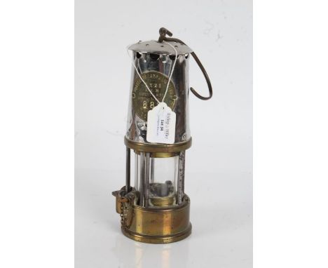 Miners lamp made by Eccles with a brass reservoir&nbsp;to the base, 25cm high