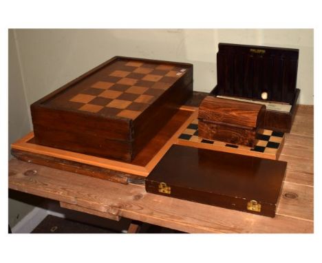 Collection of assorted wooden games to include; large chess board enclosing Backgammon, pair of dice shakers and counters, to