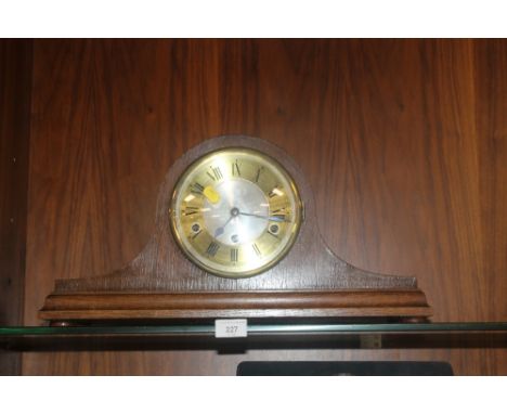 AN OAK NAPOLEON HAT MANTEL CLOCK