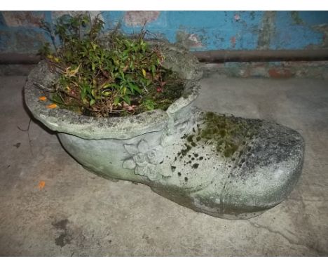 A LARGE STONE BOOT PLANTER