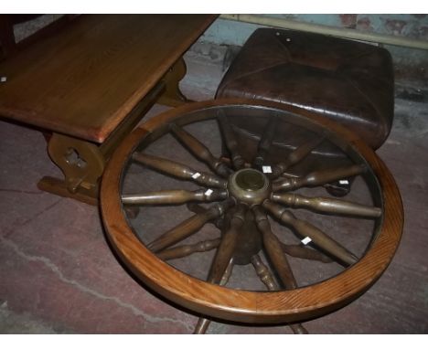 AN OAK COFFEE TABLE, A GLASS TOPPED COFFEE TABLE AND A POUFFE