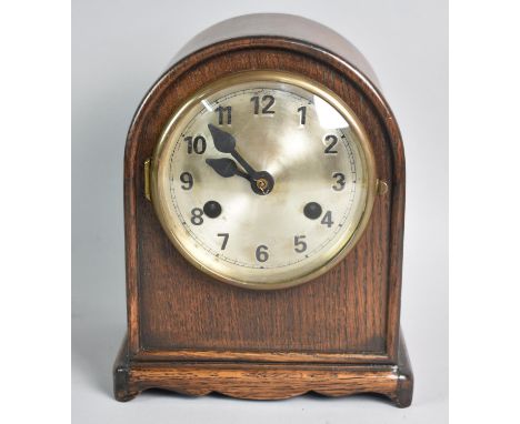 A Mid 20th Century Oak Cased Arch Topped Mantel Clock with Wurttemberg Movement, 21.5cms High