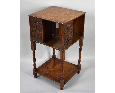 An Edwardian Oak Bookcase with Blind Carved Panelling and Turned Supports, 38cms Square and 69cms High