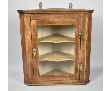 A Small Wall Hanging Glazed Corner Cupboard with Shaped Inner Shelf, 63cms Wide