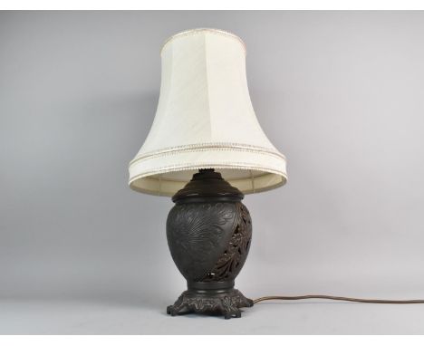 A Pierced Metal Bronze Effect Table Lamp with Shade, 54cms High Overall