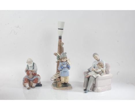 Three Lladro figures, a man with a teddy bear on his lap, father and child reading, one purposed as a lamp (3)