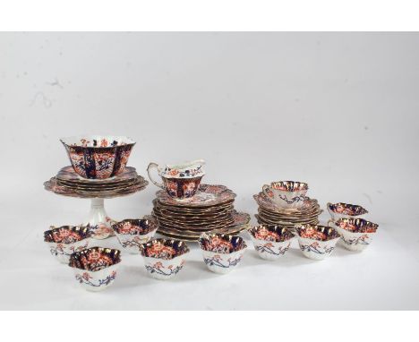 Foley porcelain tea set, in the Imari style, with iron red flowers on blue, white and gilt ground, comprising ten each tea cu