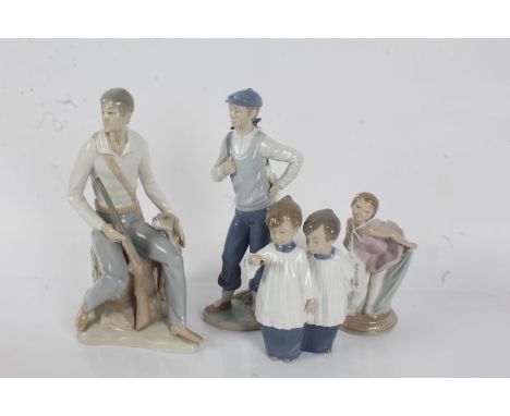 Four figures, to include Nao choir boys, Nao ballerina, Nao golfer and a Spanish figure group (4)