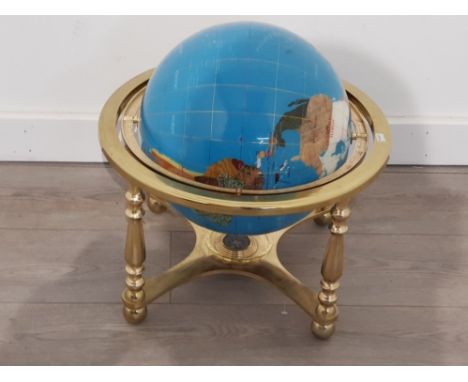 Gemstone globe on brass effect stand, revolving and complete with compass