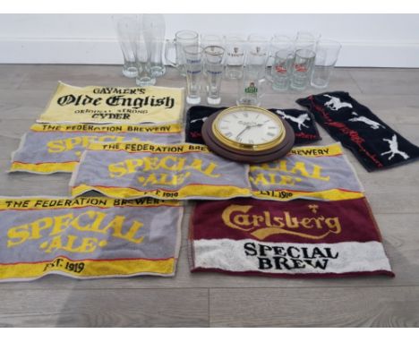 A collectable lot of drink glasses from pernod,dab guinness and carlsberg along with a carlsberg clock