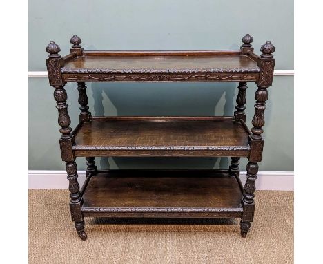19TH CENTURY CARVED & STAINED OAK BUFFET, foliate carved uprights dividing three tiers, ceramic castors, 126.5h x 115w x 45.5