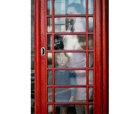 ‡JOHN BULMER (British, b.1938) colour photographic print circa 1960s - traditional red British phone box, inside a lady talki