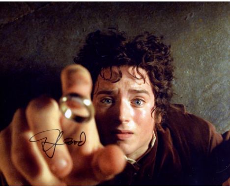 Lord of the Rings 8x10 photo signed by actor Elijah Wood as Frodo Baggins. Good condition. All autographs come with a Certifi