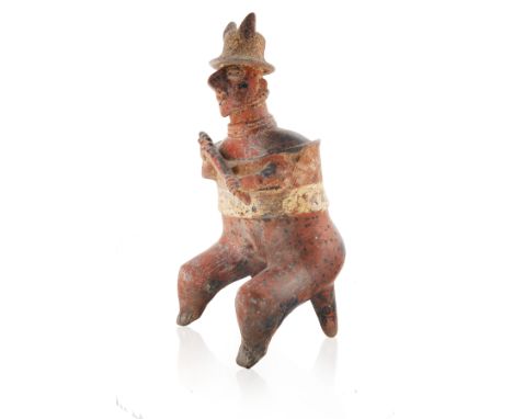 200 BCE-200 CE COLIMA SEATED WARRIOR EFFIGYshown seated on an integrated stool, holding a club in both hands, with horned hel