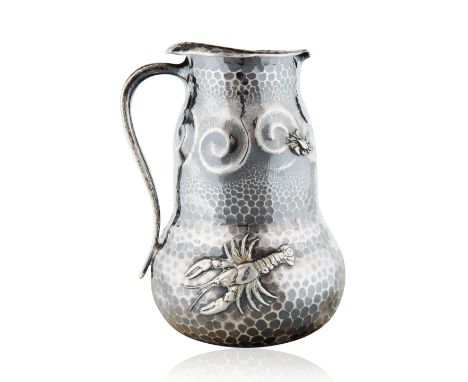 TIFFANY &amp; CO. 1880S 'JAPANESQUE' SILVER PITCHERin "Japanesque" taste, of bulbous form with slim handle, hand-hammered wit