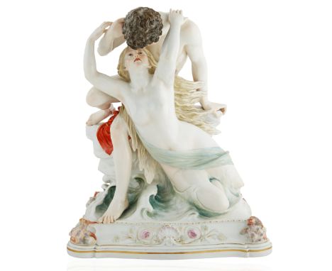 19TH CENTURY MEISSEN PORCELAIN NYMPH AND LOVERembracing atop a wave crest, both draped in cloth, atop a rocaille base accente