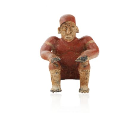 JALISCO SEATED FIGURE OF A MALE, WESTERN MEXICOwith a grimacing expression, the figure with muscular form with sculpted hands