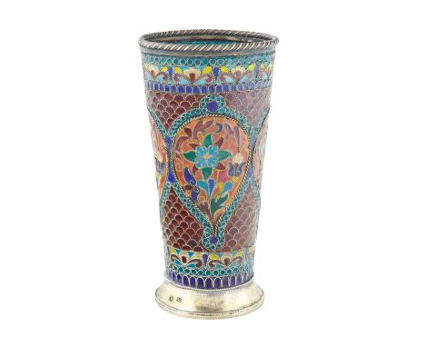 A PLIQUE A JOUR RUSSIAN SILVER AND ENAMEL CUPof tapered cylindrical form, the body decorated with enameled floral and foliate