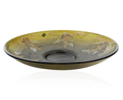 LEGRAS PAINTED GLASS PLATErounded with a lifted rim, the cavetto featuring wild hocks of flowers, against a deep green opaque