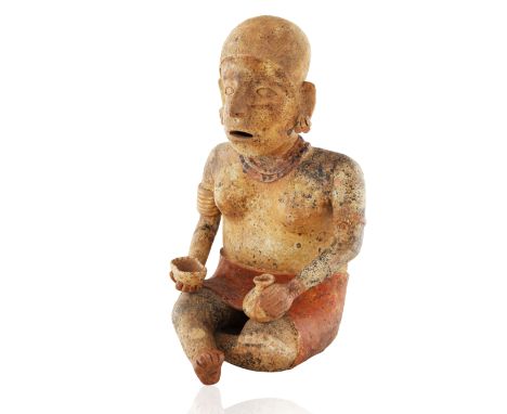 JALISCO SEATED FIGURE OF A WOMAN, WESTERN MEXICOnude from the waist up and seated in a cross legged position the arms resting