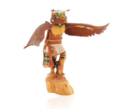 HOPI KACHINA SCULPTURE REPRESENTING KWAHUdepicted standing upright, spreading carved wings and squawking, atop a natural wood